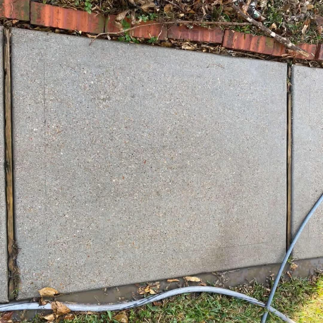 Same sidewalk after cleanup and washing
