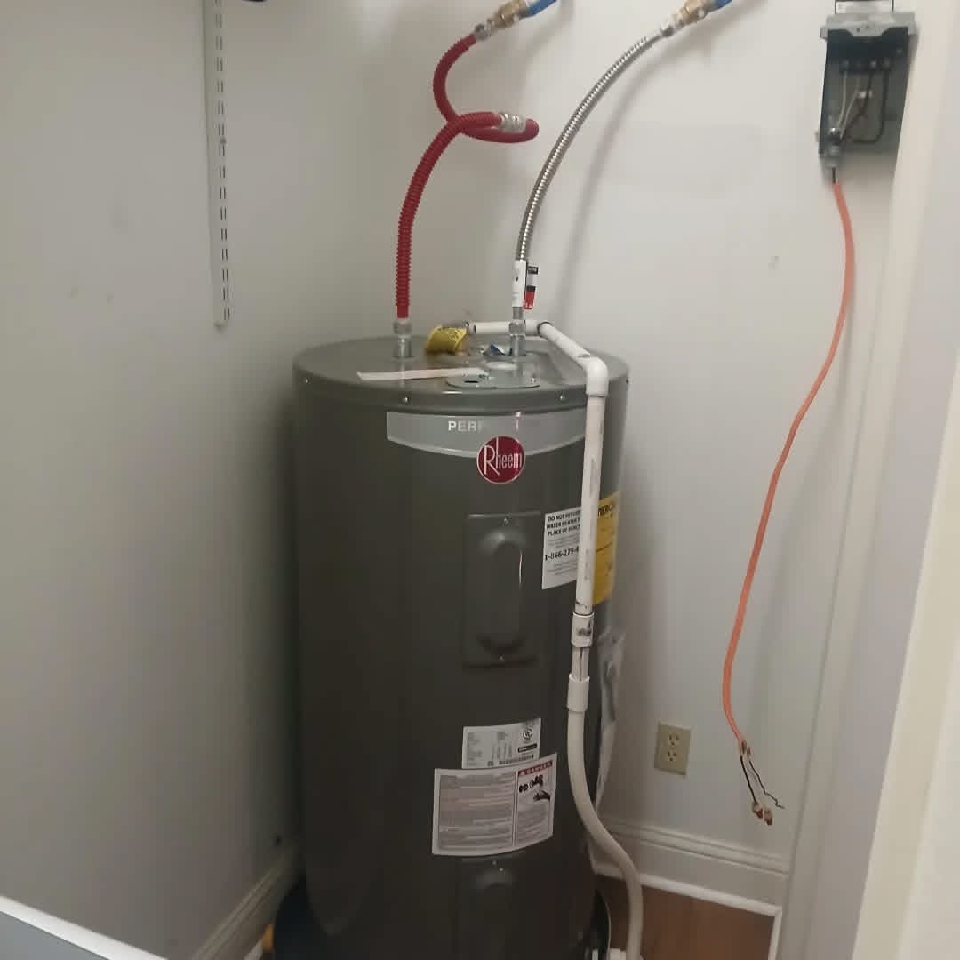 Newly installed Rheem water heater with fresh supply lines